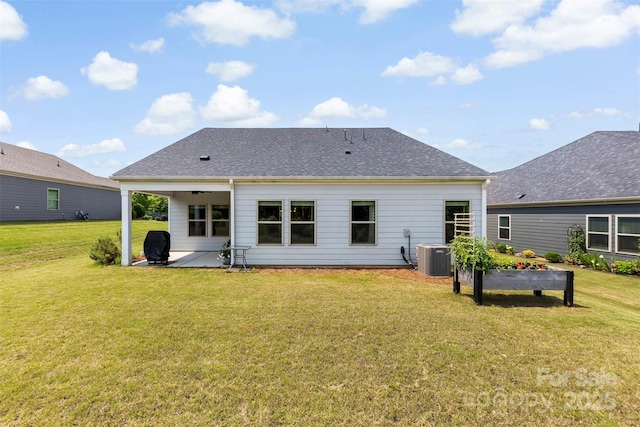 5727 Lavaux Ct, Charlotte, NC 28214 - back of house featuring a patio, a lawn, central AC, and a shingled roof