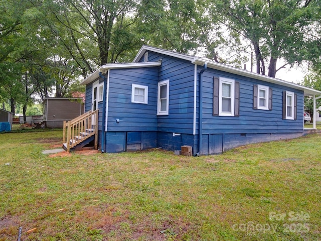 view of front of property with crawl space and a front yard