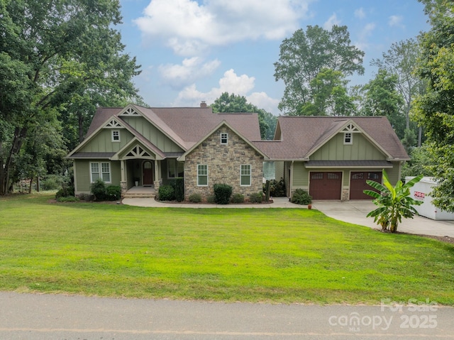 221 Stillwater Rd, Troutman, NC 28166 - craftsman house with board and batten siding, stone siding, a front yard, concrete driveway, and a porch