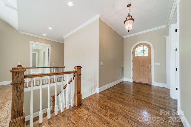 221 Stillwater Rd, Troutman, NC 28166 - entrance foyer with wood finished floors, recessed lighting, and ornamental molding