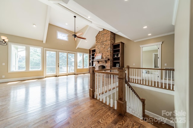 221 Stillwater Rd, Troutman, NC 28166 - hallway featuring wood finished floors, beam ceiling, an upstairs landing, high vaulted ceiling, and recessed lighting