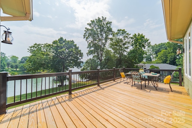 221 Stillwater Rd, Troutman, NC 28166 - wooden terrace featuring outdoor dining space and view of wooded area