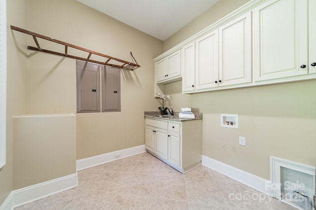 221 Stillwater Rd, Troutman, NC 28166 - washroom featuring cabinet space, washer hookup, electric panel, and light tile patterned flooring