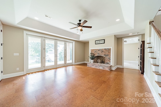 221 Stillwater Rd, Troutman, NC 28166 - unfurnished living room featuring a raised ceiling, tile patterned floors, a ceiling fan, a fireplace, and recessed lighting