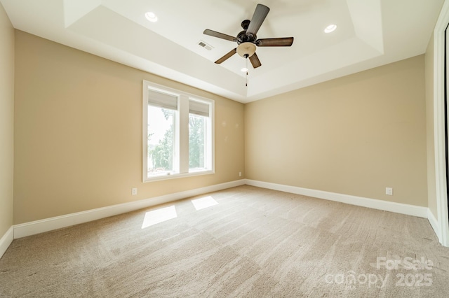 221 Stillwater Rd, Troutman, NC 28166 - spare room featuring a raised ceiling, light carpet, ceiling fan, and recessed lighting