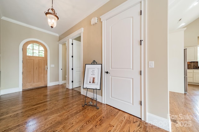 221 Stillwater Rd, Troutman, NC 28166 - foyer entrance featuring wood finished floors and ornamental molding