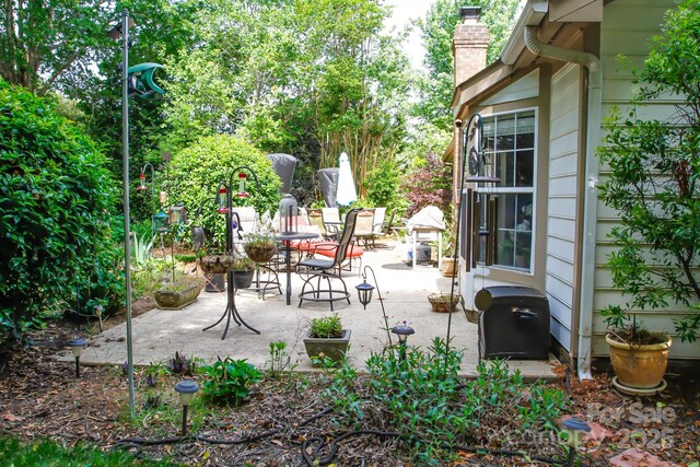 view of patio featuring outdoor dining area