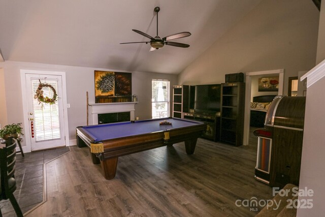 playroom featuring a ceiling fan, billiards table, dark wood-style floors, a fireplace, and high vaulted ceiling