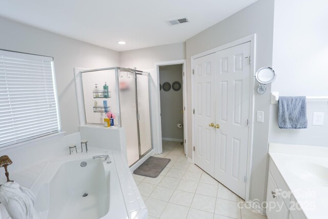 full bath featuring a shower stall, a garden tub, tile patterned floors, vanity, and recessed lighting