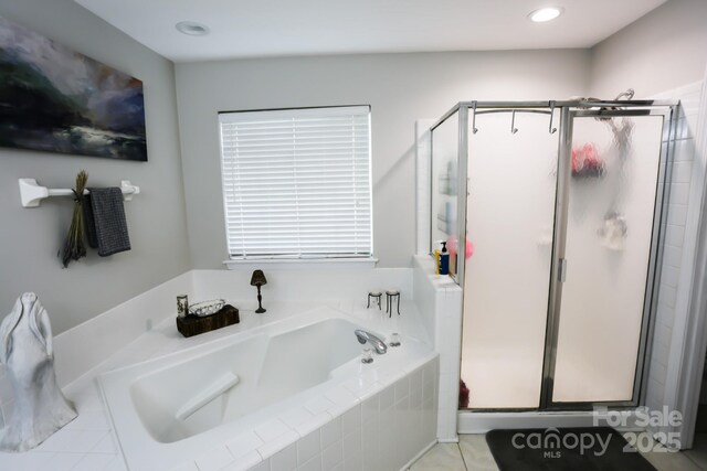 bathroom with a garden tub, a stall shower, tile patterned floors, and recessed lighting