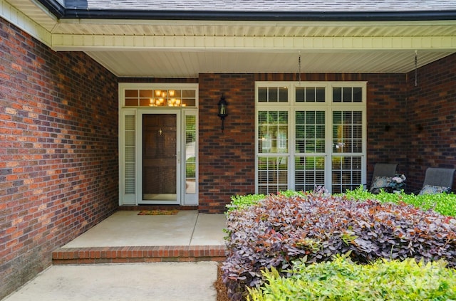 entrance to property with brick siding