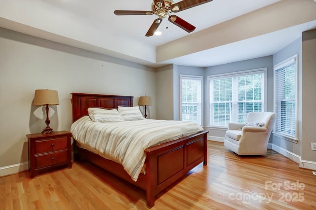 bedroom with baseboards, light wood-style floors, and recessed lighting