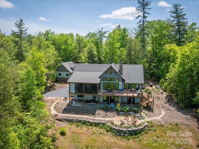 2054 Catawba Trl Unit 162, Nebo, NC 28761 - back of property with stairs, a deck, a wooded view, and a patio area