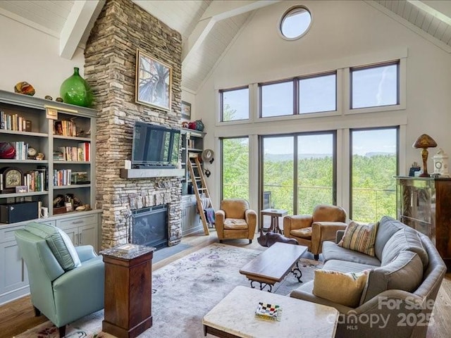 2054 Catawba Trl Unit 162, Nebo, NC 28761 - living room featuring a stone fireplace, high vaulted ceiling, wood finished floors, wooden ceiling, and beamed ceiling