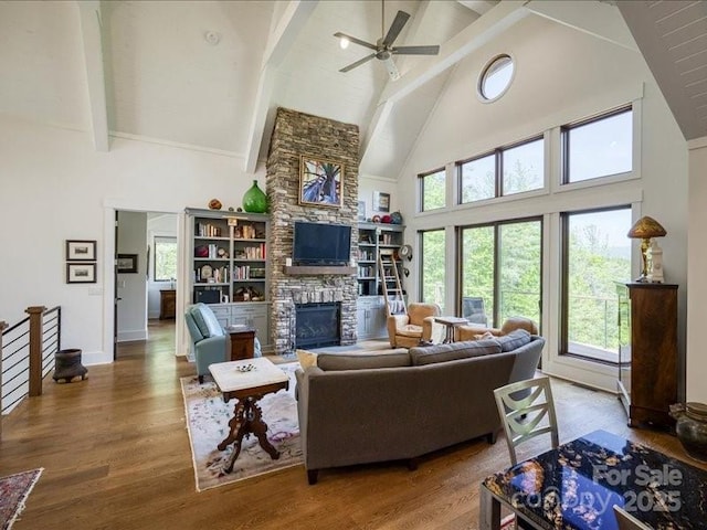 2054 Catawba Trl Unit 162, Nebo, NC 28761 - living area with high vaulted ceiling, ceiling fan, a fireplace, beam ceiling, and wood finished floors