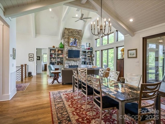 2054 Catawba Trl Unit 162, Nebo, NC 28761 - dining space featuring high vaulted ceiling, a chandelier, wood finished floors, beam ceiling, and a fireplace
