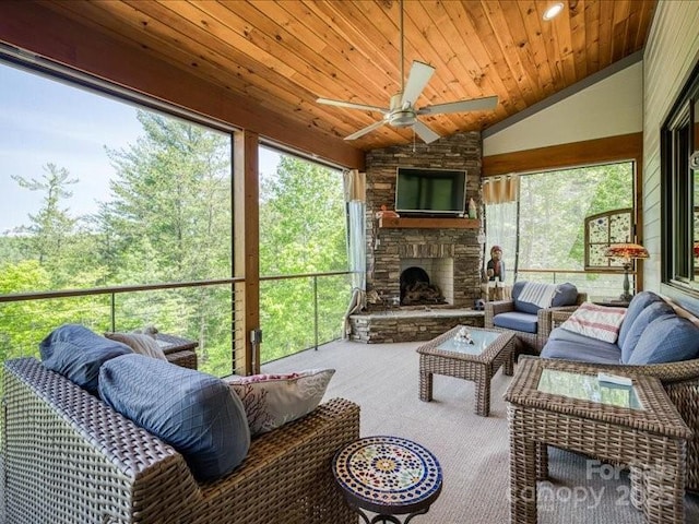 2054 Catawba Trl Unit 162, Nebo, NC 28761 - sunroom / solarium featuring ceiling fan, vaulted ceiling, an outdoor living space with a fireplace, and plenty of natural light