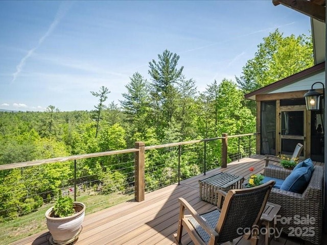 2054 Catawba Trl Unit 162, Nebo, NC 28761 - deck featuring a view of trees and a sunroom