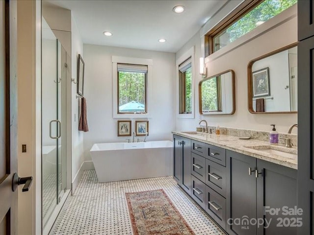 2054 Catawba Trl Unit 162, Nebo, NC 28761 - bathroom featuring a stall shower, tile patterned floors, a freestanding tub, double vanity, and baseboards