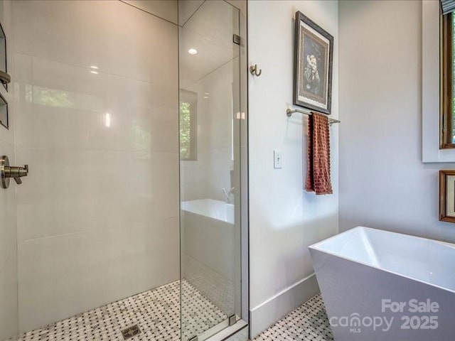 2054 Catawba Trl Unit 162, Nebo, NC 28761 - bathroom with a shower stall, a soaking tub, and baseboards
