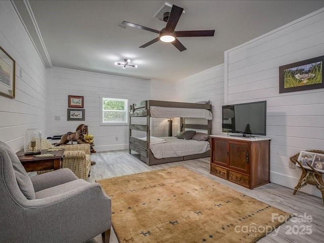 2054 Catawba Trl Unit 162, Nebo, NC 28761 - bedroom with light wood-type flooring, crown molding, wood walls, and ceiling fan