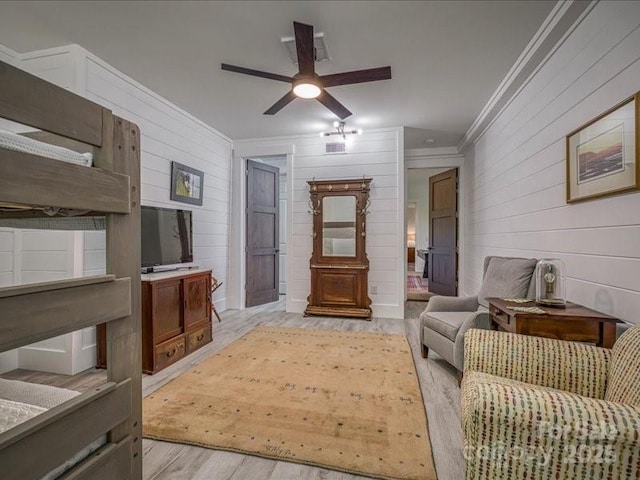 2054 Catawba Trl Unit 162, Nebo, NC 28761 - living area with crown molding, light wood-style flooring, wooden walls, a ceiling fan, and lofted ceiling
