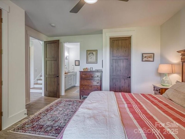 2054 Catawba Trl Unit 162, Nebo, NC 28761 - bedroom featuring baseboards, ensuite bathroom, light wood-style flooring, and a ceiling fan