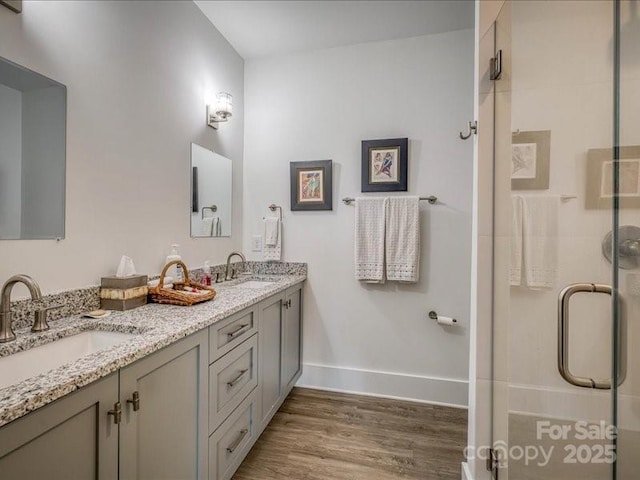 2054 Catawba Trl Unit 162, Nebo, NC 28761 - full bath with wood finished floors, a stall shower, baseboards, and double vanity