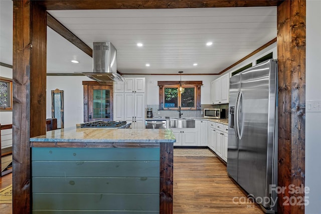 466 Hanging Rock Rd, Mars Hill, NC 28754 - kitchen with appliances with stainless steel finishes, a sink, island exhaust hood, white cabinetry, and wood finished floors