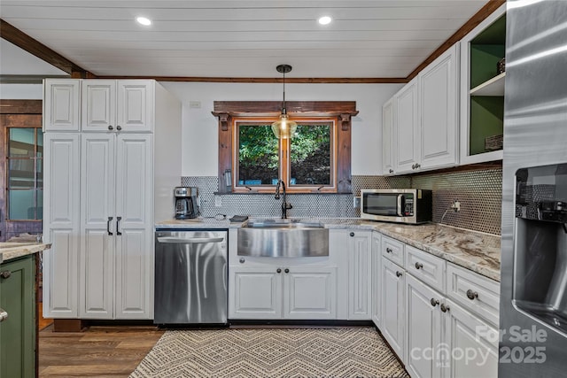 466 Hanging Rock Rd, Mars Hill, NC 28754 - kitchen featuring stainless steel appliances, a sink, white cabinets, wood finished floors, and decorative backsplash
