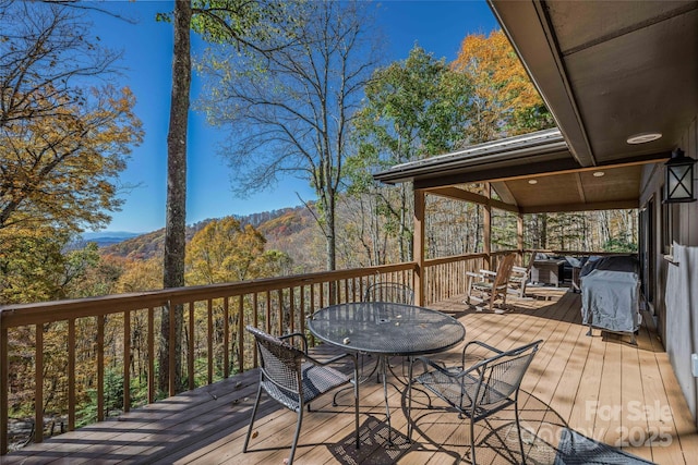 466 Hanging Rock Rd, Mars Hill, NC 28754 - wooden deck with outdoor dining area, a mountain view, and a grill