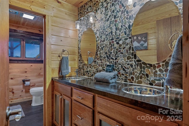 466 Hanging Rock Rd, Mars Hill, NC 28754 - bathroom with wooden walls, toilet, wood finished floors, wood ceiling, and double vanity