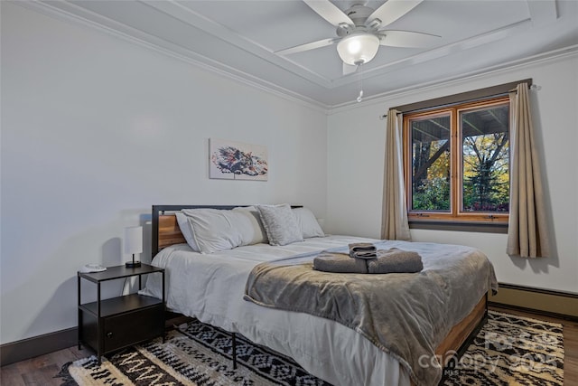 466 Hanging Rock Rd, Mars Hill, NC 28754 - bedroom with wood finished floors, baseboard heating, crown molding, a tray ceiling, and ceiling fan