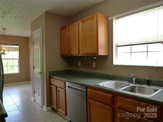 37 S Woodridge View Ct, Hendersonville, NC 28791 - kitchen featuring stainless steel dishwasher, a sink, a textured ceiling, light tile patterned floors, and dark countertops