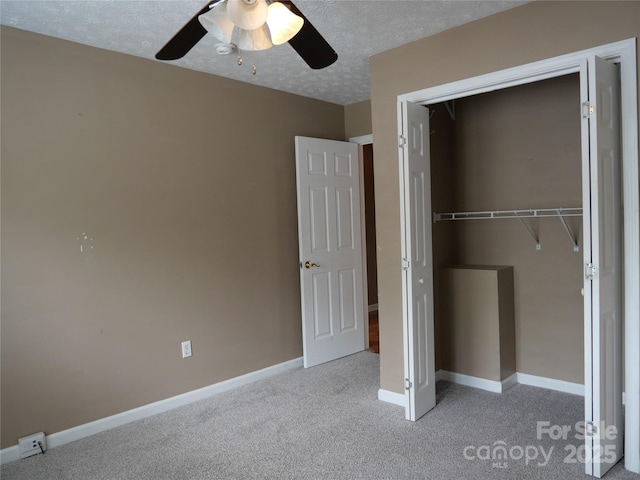 37 S Woodridge View Ct, Hendersonville, NC 28791 - unfurnished bedroom with a closet, light carpet, baseboards, ceiling fan, and a textured ceiling