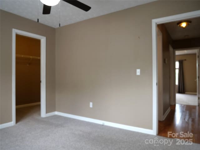 37 S Woodridge View Ct, Hendersonville, NC 28791 - unfurnished bedroom featuring baseboards, carpet floors, a closet, and ceiling fan