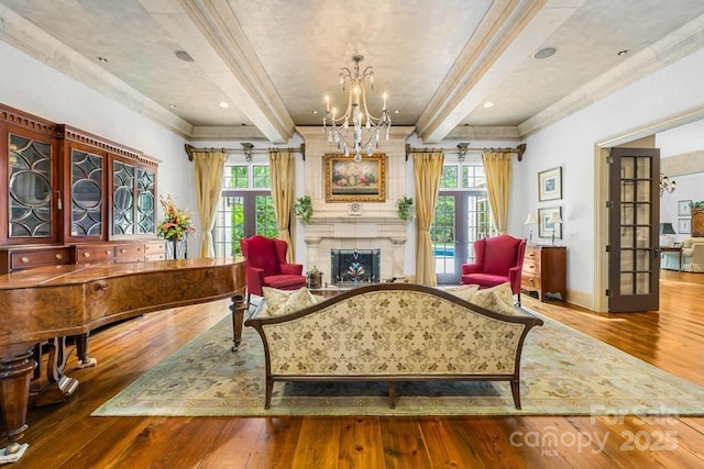 4523 Fox Brook Ln, Charlotte, NC 28211 - living area featuring beamed ceiling, hardwood / wood-style floors, plenty of natural light, a fireplace, and crown molding