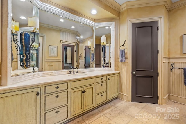 4523 Fox Brook Ln, Charlotte, NC 28211 - bathroom featuring crown molding, a decorative wall, a wainscoted wall, vanity, and recessed lighting