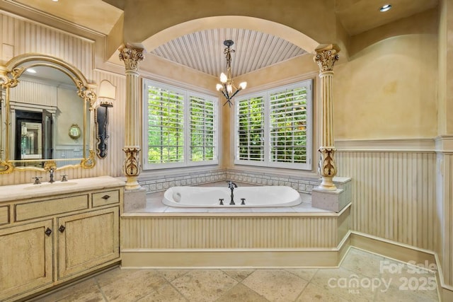 4523 Fox Brook Ln, Charlotte, NC 28211 - full bathroom featuring a chandelier, a bath, vanity, and ornamental molding