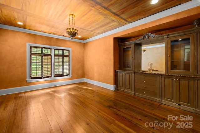 4523 Fox Brook Ln, Charlotte, NC 28211 - spare room featuring baseboards, wood ceiling, dark wood-style flooring, a chandelier, and ornamental molding