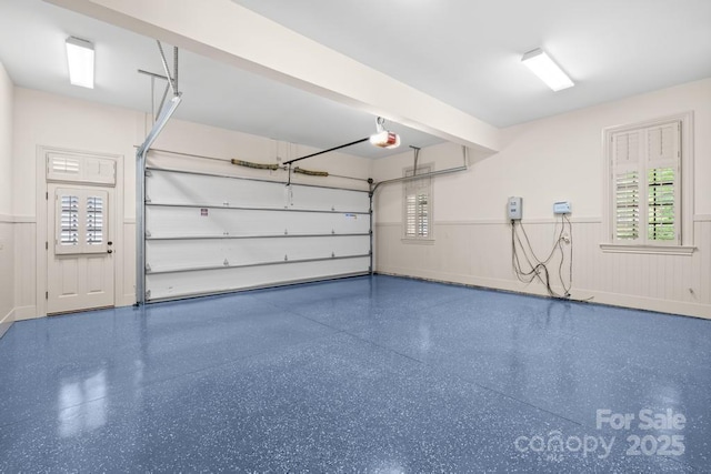 4523 Fox Brook Ln, Charlotte, NC 28211 - garage with a wainscoted wall and a garage door opener