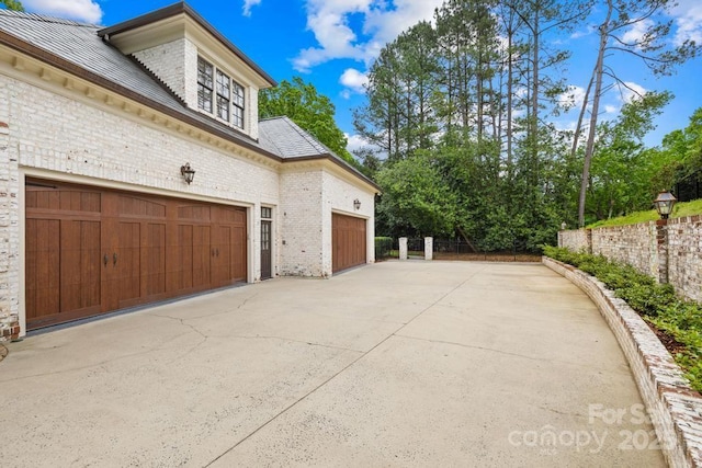 4523 Fox Brook Ln, Charlotte, NC 28211 - view of property exterior with brick siding, driveway, and an attached garage