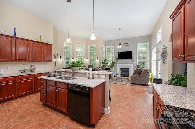 kitchen with black appliances, a glass covered fireplace, a ceiling fan, and light tile patterned flooring