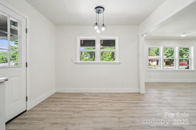 1417 W Monroe St, Salisbury, NC 28144 - unfurnished dining area with light wood-style flooring and baseboards