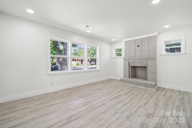 1417 W Monroe St, Salisbury, NC 28144 - unfurnished living room featuring wood finished floors, recessed lighting, baseboards, and a fireplace