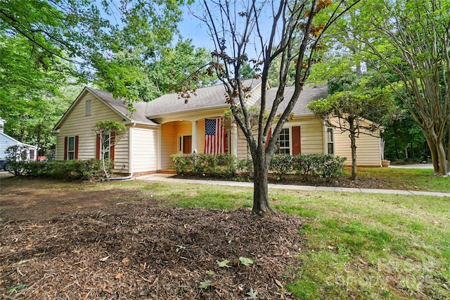 ranch-style house with a shingled roof