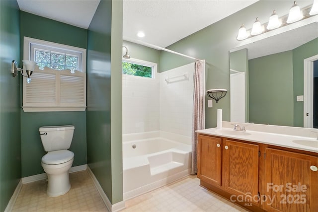 bathroom featuring tile patterned floors, toilet, baseboards, shower / bath combo, and double vanity
