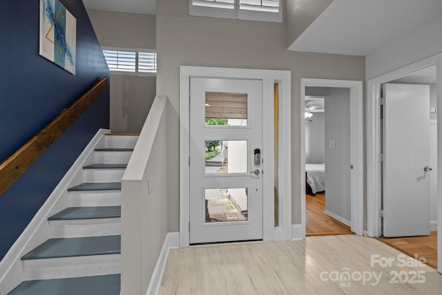 222 Riverview Ter, Clover, SC 29710 - foyer with healthy amount of natural light, wood finished floors, stairs, and baseboards