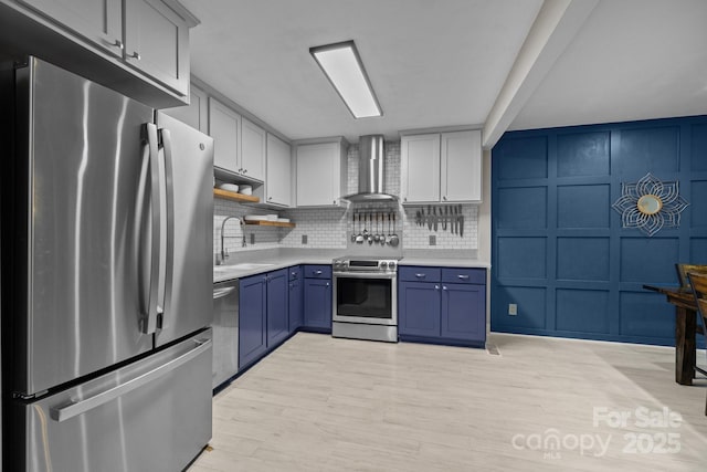 222 Riverview Ter, Clover, SC 29710 - kitchen with stainless steel appliances, wall chimney range hood, a sink, a decorative wall, and light countertops