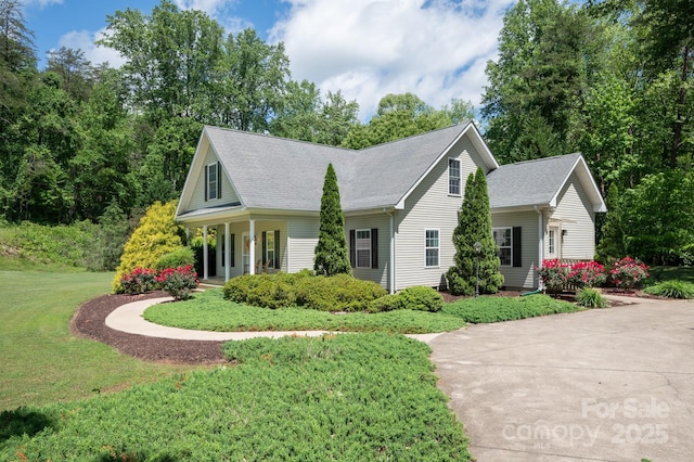19 Lynnbrook Way, Columbus, NC 28722 - view of front of house with a front yard, covered porch, and roof with shingles
